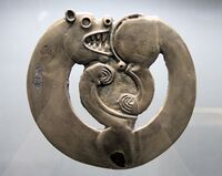 Curled-up feline animal from Arzhan-1, circa 800 BC.[189]