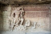 Vishnu in the form of Varaha, Udayagiri caves, circa 400 CE.[61] In front, probable relief of Chandragupta II (380–415 CE) kneeling, paying homage to Varaha.[62]