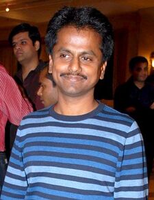 A picture of AR Murugadoss as he looks at the camera.