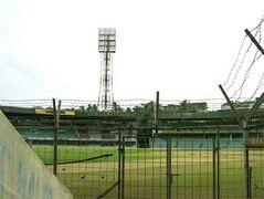 Before renovation - stands, floodlight tower from a spectator view from one of the stands.