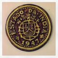 1947 escudo coin.