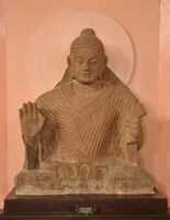 Buddha in Abhaya Mudra. Kushana-Gupta transitional period. Circa 3rd-4th century, Mathura.[44]