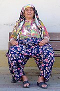 A woman in Selçuk, Turkey wearing traditional Turkish trousers similar to a salwar.