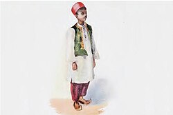 image of a standing boy in a religious costume