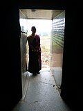 Entrance corridor, polished walls with the Gopika Cave Inscription of the 5th century CE.
