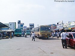 Buses and cars on a busy street