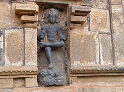 Dakshinamurti portrayed as the teacher of yoga, dance and sciences stepping over demon of ignorance.[48]