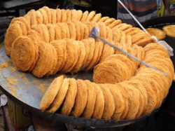 A bunch of nest-like threaded food having golden brown color