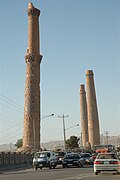 Traffic passing on the road near the Herat minarets, 2005.