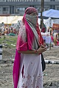 The dupatta's use as protection against dust or the sun.