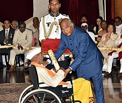 President Ram Nath Kovind felicitates Hiralal Yadav with Padma Shri