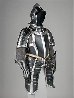 Black painted suit of German armor crafted circa 1600. As with many outfits, black in the piece is used to contrast against lighter colors.[26]