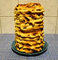 European spit cakes are baked around a metal cylinder.