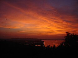 View of Ponte Conde de Linhares along the Mandovi River at dusk