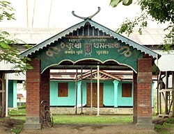 Grand gate of Shrine of Lord Khamlangba, with a holy horn in the top