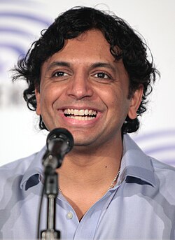 Shyamalan smiling