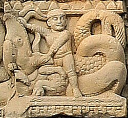 Foreigner with headband fighting a Makara. Torana of Stupa 3 in Sanchi.