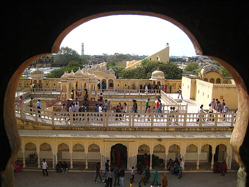 View from the back part towards Samrat Yantra of Jantar Mantar in this photo at the top right corner in the form of an inclined wall. Isarlat is also visible in this photo at left top corner as a large tower.
