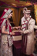 Bride in Sari and Groom in Sherwani in a Hindu Indian wedding.