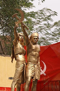 A tableau in a CPI(M) rally in Kerala, India showing two farmers forming the hammer and sickle