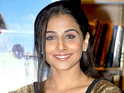 Vidya Balan is looking directly at the camera.