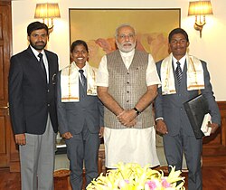 Poorna Malavath and Anand Kumar, teenaged mountaineers who recently scaled Mt. Everest, calling on the Prime Minister, Shri Narendra Modi, in New Delhi on June 06, 2014. Their coach, Shri Shekhar Babu is also seen (1).jpg