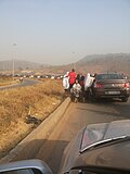 Muslim beggars stalk a car in Nigeria.