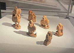 These seven ivory chess pieces are the oldest known, dating to about 700 CE. The ivory came from India.[27] They were excavated in 1977 by archaeologist Yuriy Buryakov, at Afrasiyab in Samarkand, Uzbekistan.[28] They are housed today at the Samarkand State Museum. Photographed during a loan of the pieces to the Silk Roads Exhibition at the British Museum.