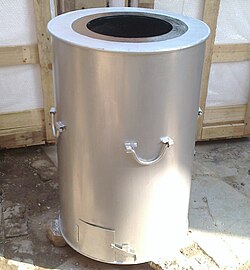 A coal-fired tandoor with a mild steel drum