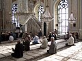 Muslim men praying at the Ortaköy Mosque in Istanbul