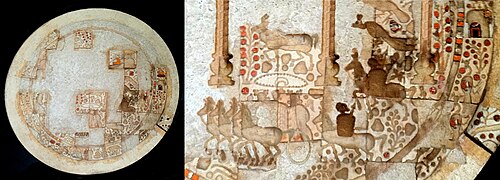 A disc made out of mother-of-pearl, with partial ornamentation still visible, alongside a possible reconstruction of the original decoration