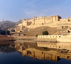 Amber Fort as seen from the bank of Maotha Lake, Jaigarh Fort on the hills in the background