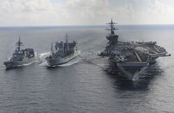 3 ships at sea sailing in formation
