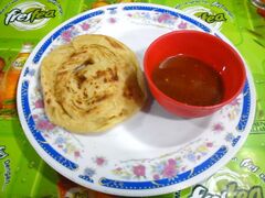 Roti canai, also known as roti parotta