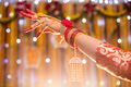 A Bengali Muslim bride's hand adorned with alta on her Gaye Holud