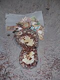 The foot imprint at Big foot museum is often adorned with money.