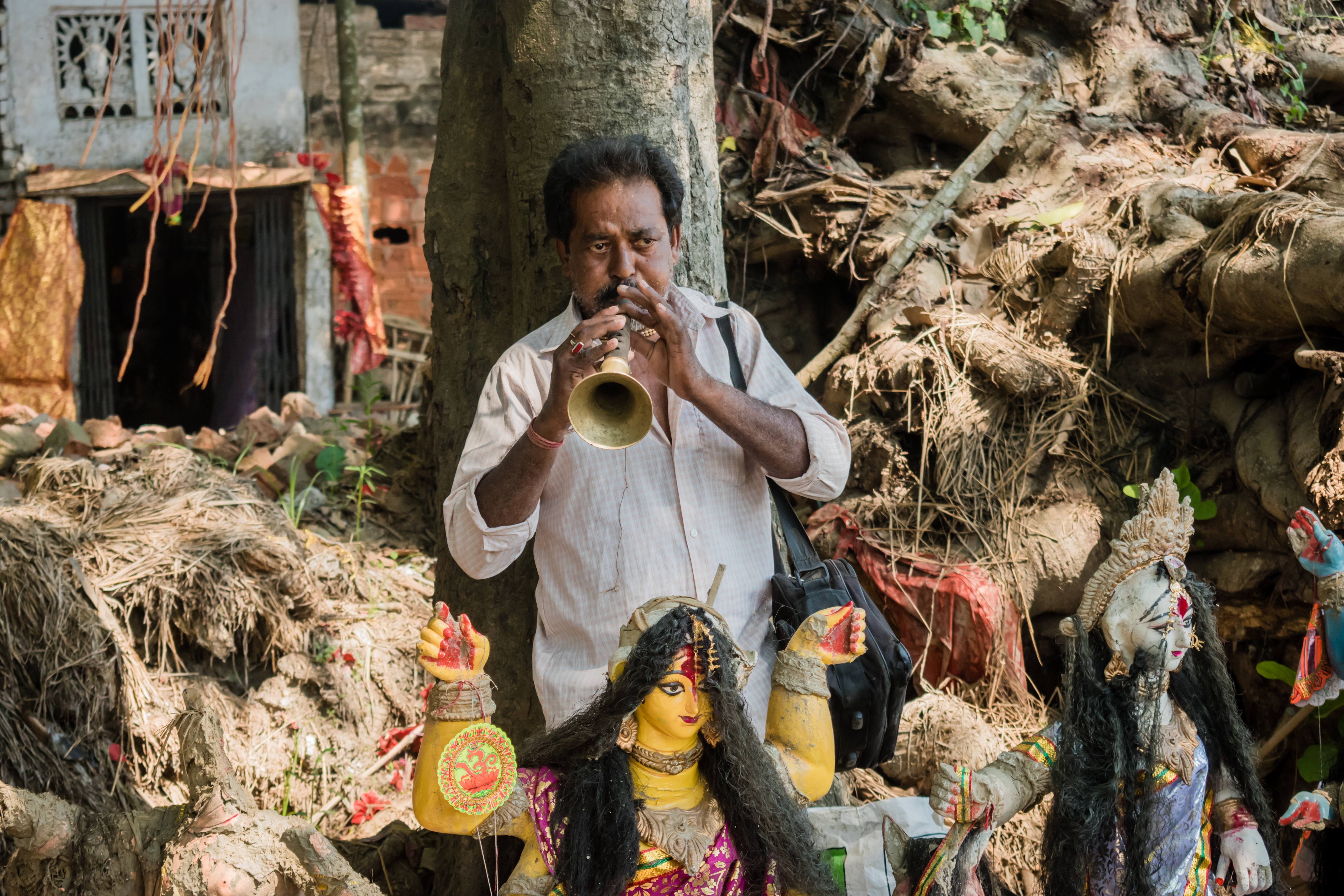 India. A tribal shehnai player.