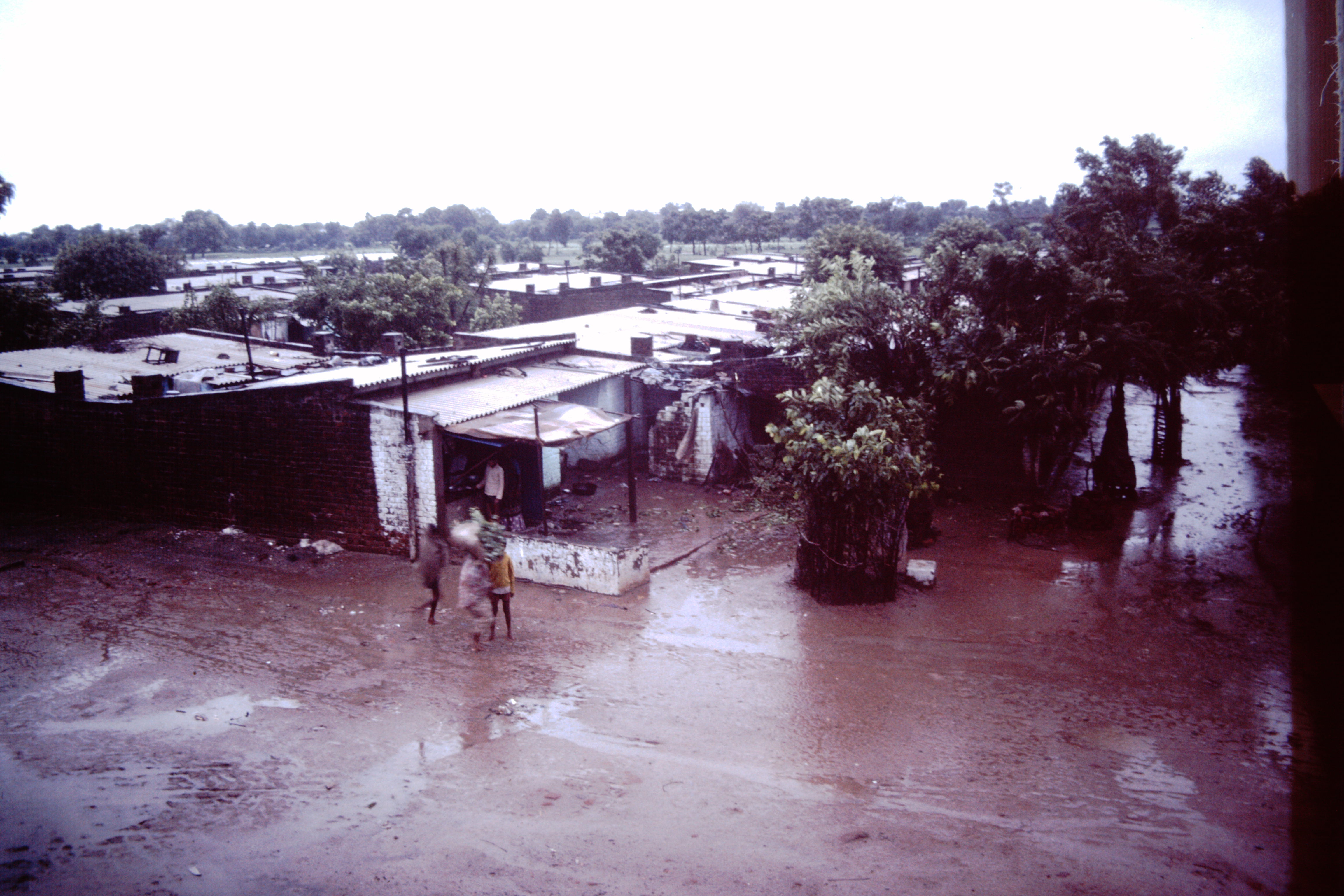 Ahmedabad-India-slums-1979-IHS-89-16-Slum in-the-rain.jpeg