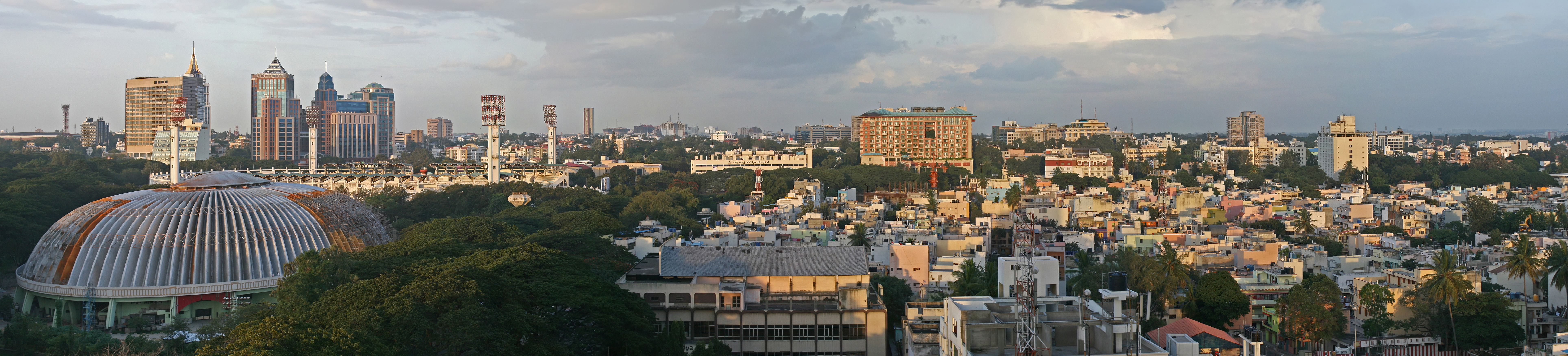 A panorama of Bangalore, the centre of India's software development economy. In the 1980s, when the first multinational corporations began to set up centres in India, they chose Bangalore because of the large pool of skilled graduates in the area, in turn due to the many science and engineering colleges in the surrounding region.[298]