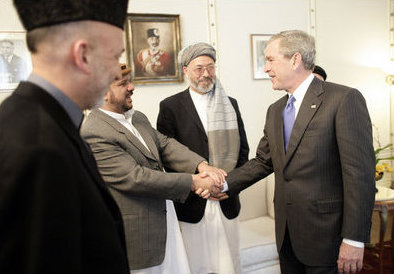 Karim Khalili, 2nd Vice President of Afghanistan (with turban) is standing next to Mohammed Fahim, George W. Bush, facing Hamid Karzai