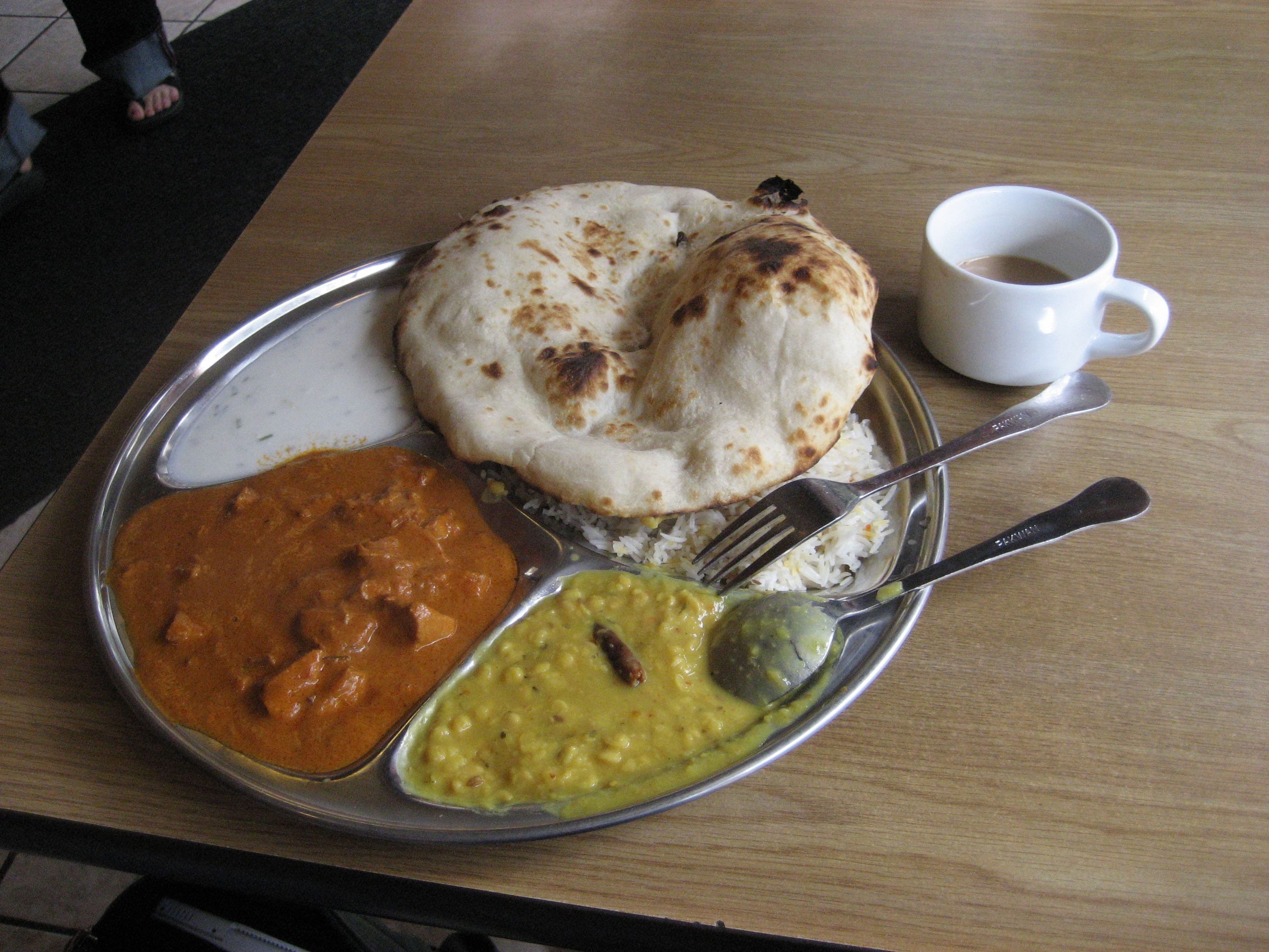 Tandoori roti served with other dishes in an Indian restaurant