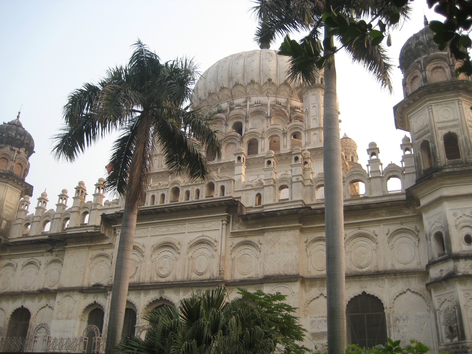 The main entrance way of Maqbara is lined with palm trees.