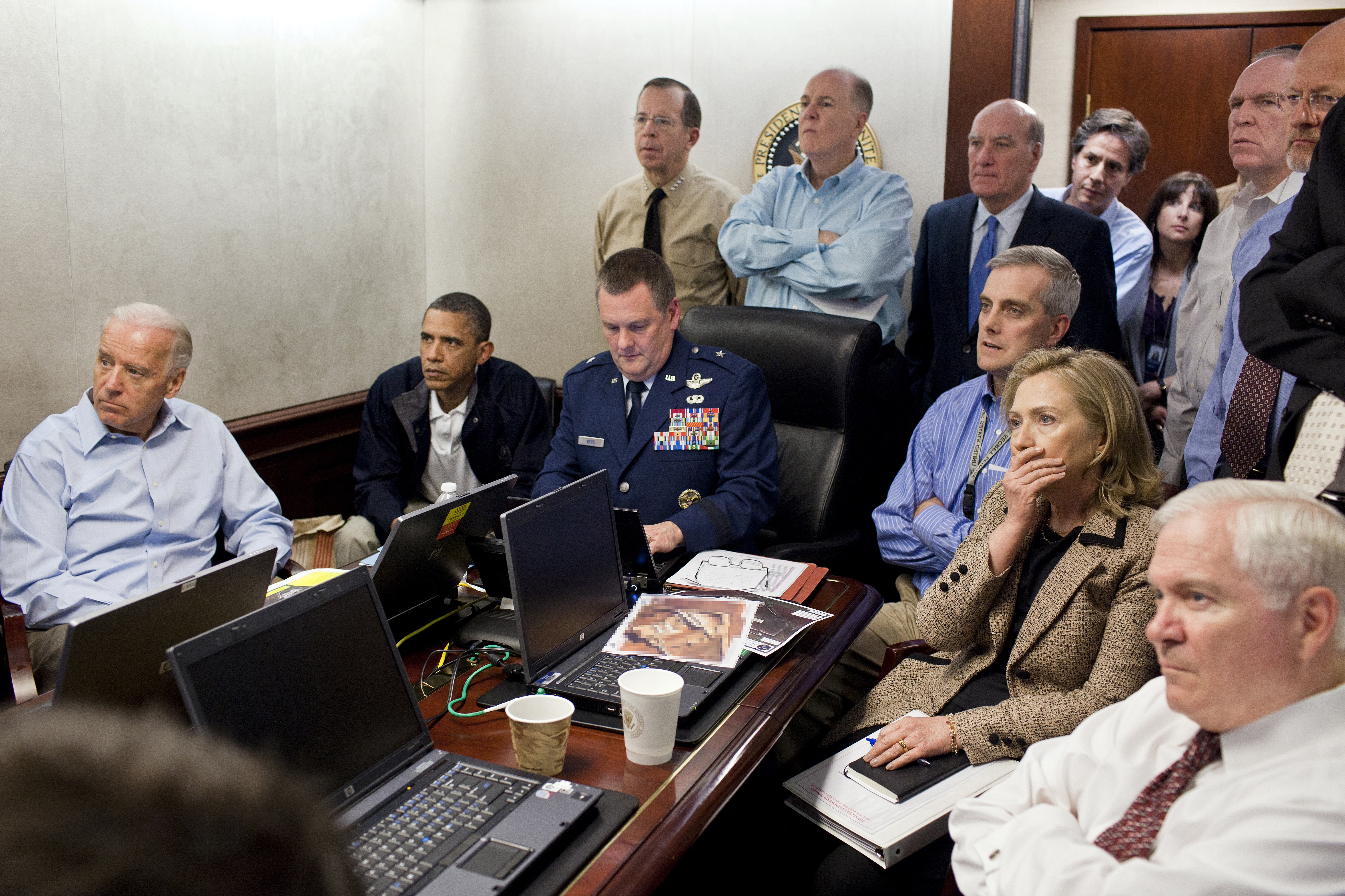 Photo of Obama, Biden, and national security staffers in the Situation Room, somberly listening to updates on the bin Laden raid