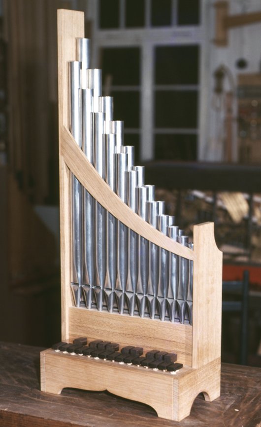 cf. Portative organ (portable pipe organ with bellows)