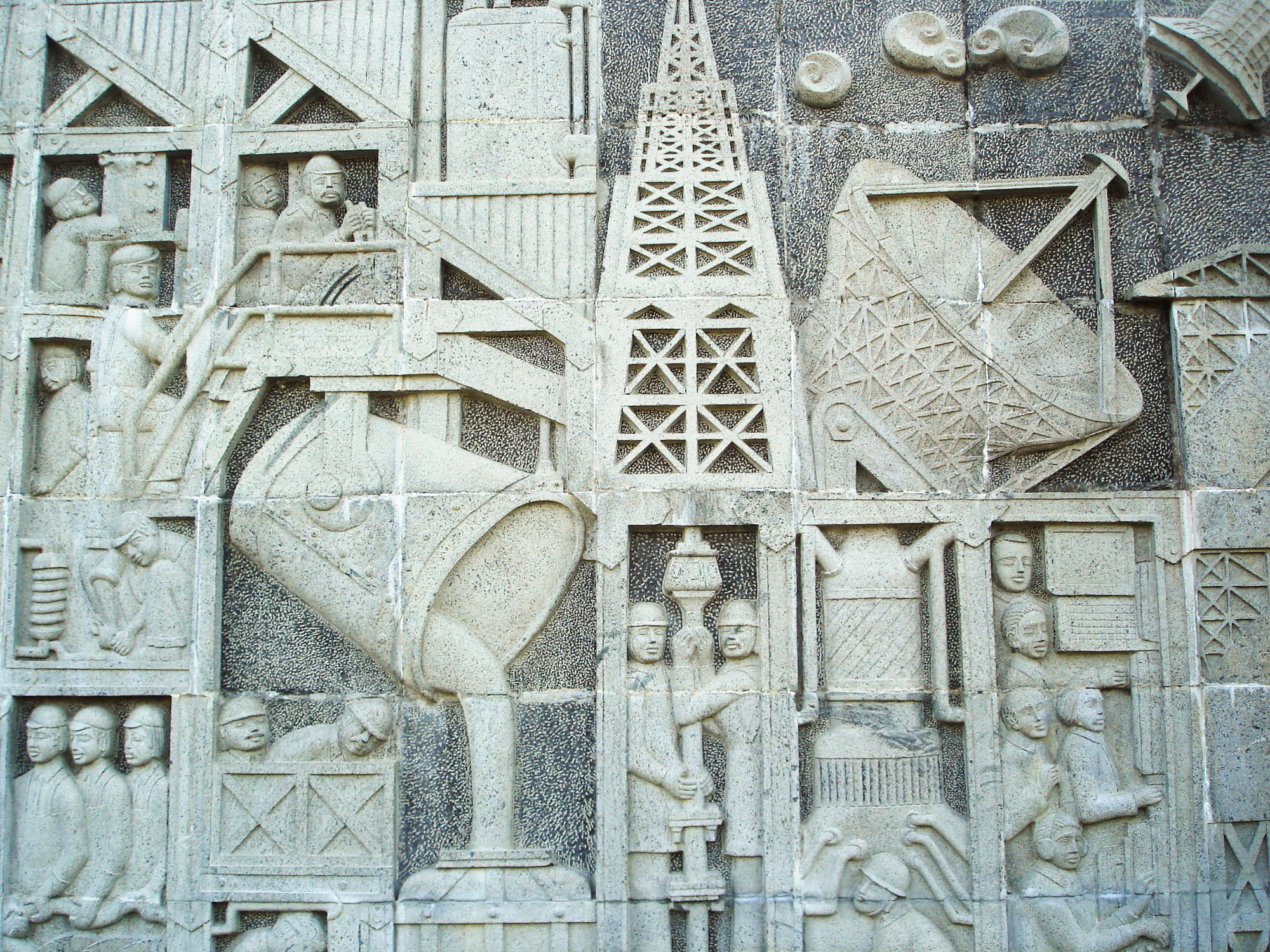 A stone sculpture depicting India's progress at the memorial