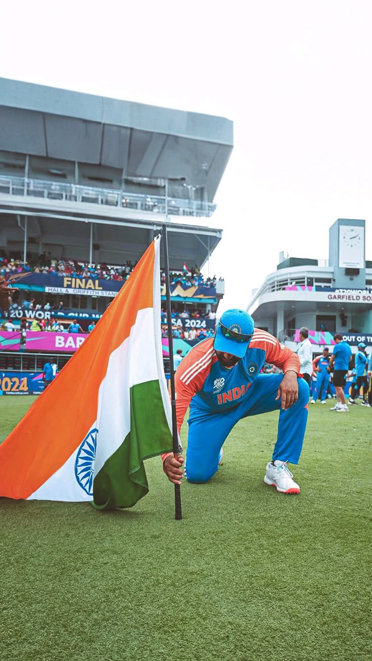 Rohit Sharma hoists the Indian flag at Kensington Oval, Barbados after winning 2024 Men's T20 World Cup final