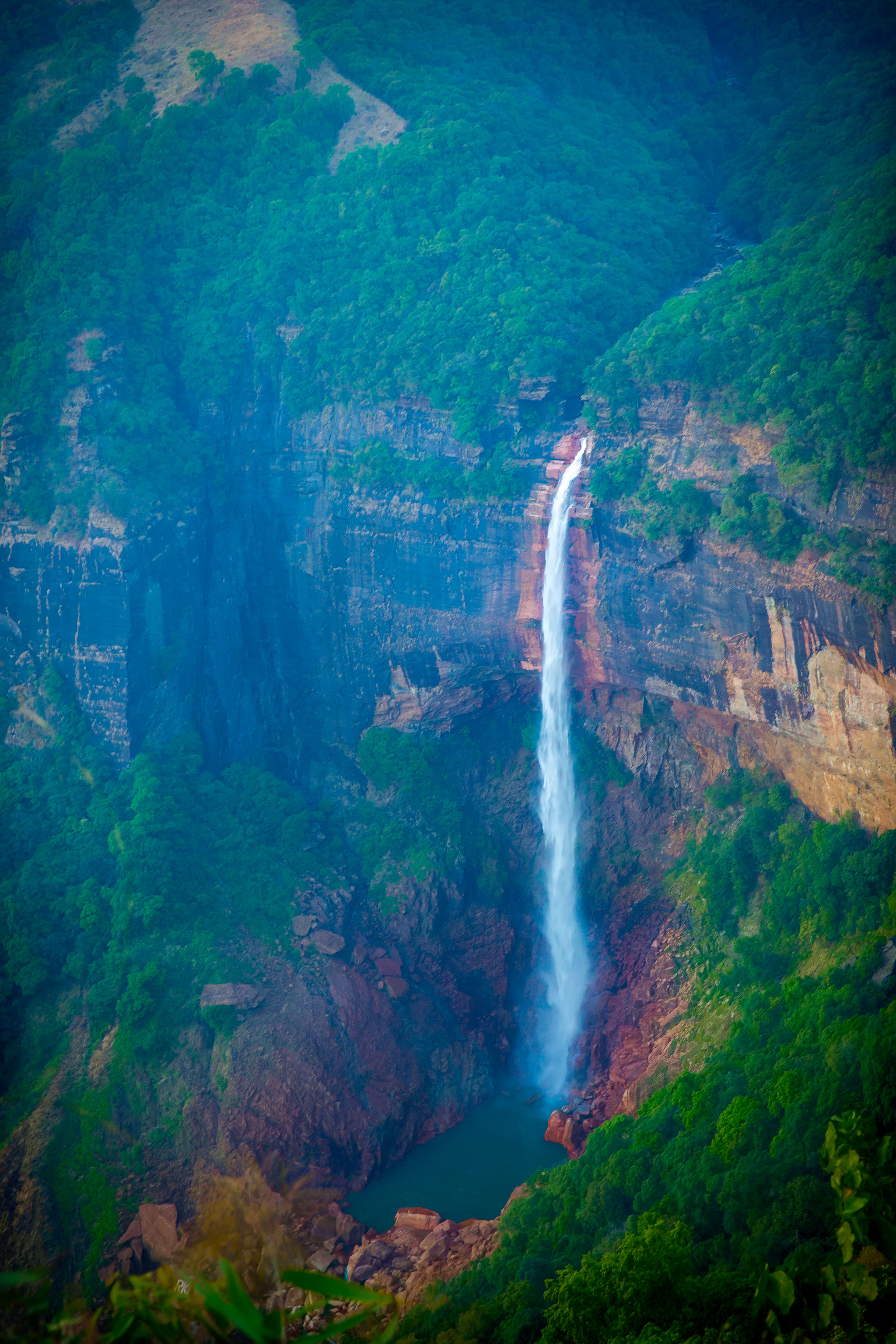 The Elegant Nohkalikai Falls during a summer sunset.jpg