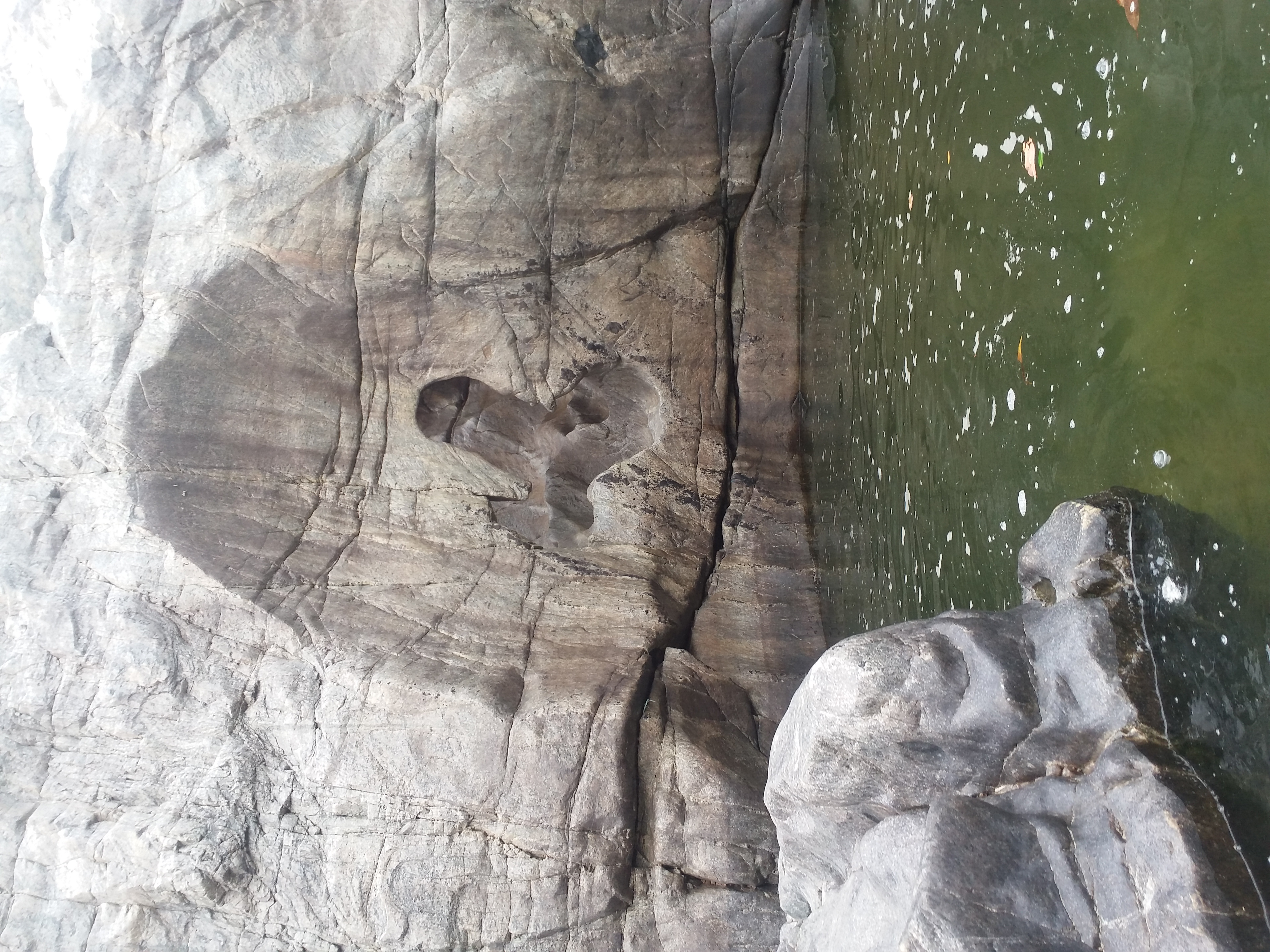 Whirlpool damaged mountain portion in Hogenakkal Falls in Tamil Nadu